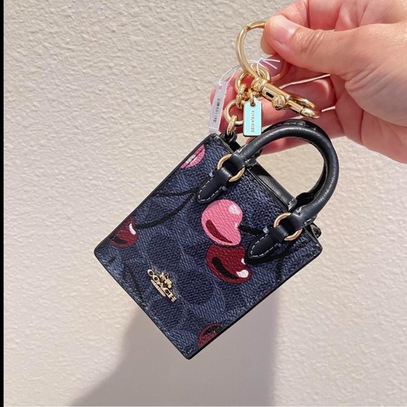 ✅Coach North/South Mini Tote Bag Charm In Signature Canvas With Cherry Print - Picture 1 of 8